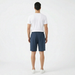 Men's summer linen shorts by FJØRNA, featuring a relaxed fit and light fabric, shown in a neutral color.