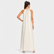 FJØRNA women's sleeveless halter neck summer maxi dress with flowing fabric and vibrant pattern, perfect for warm weather.