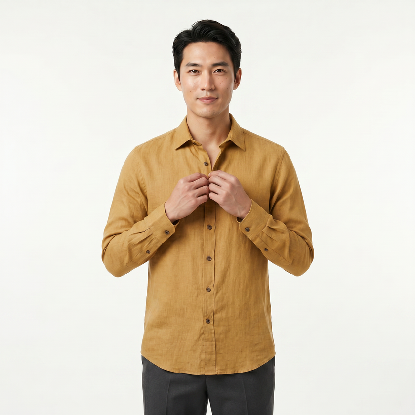 Men's FJØRNA long sleeve cotton button-down shirt shown in a classic design with a collar and button front, in a neutral color.