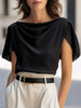Black satin women's blouse with cap sleeves and draped design by FJØRNA, shown on a model.