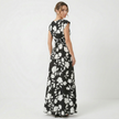 Women's floral print V-neck summer maxi dress by FJØRNA, flowing fabric with vibrant floral pattern and sleeveless design.