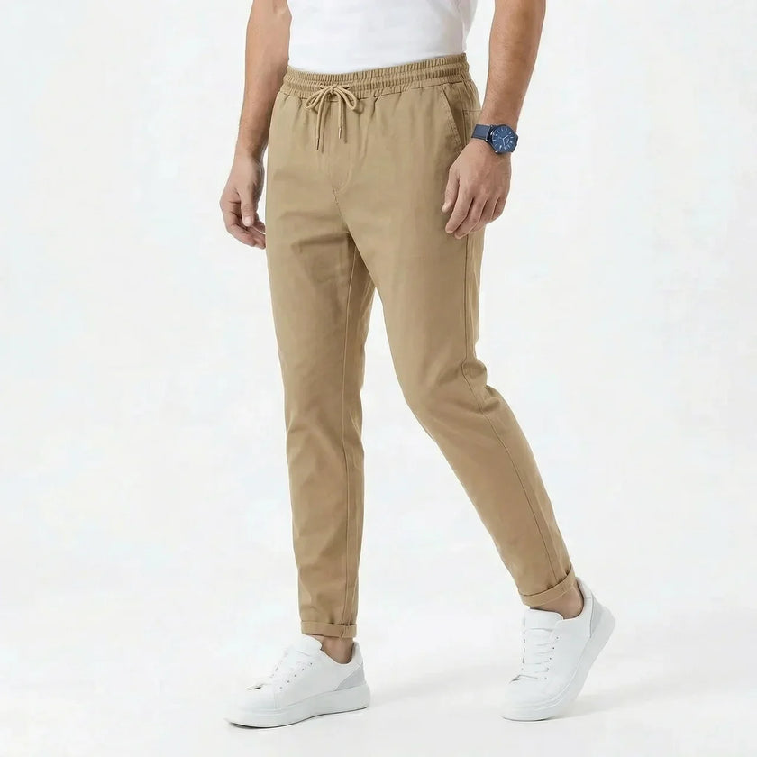 Men's stretchable comfort trousers by FJØRNA, shown in a relaxed fit with a versatile waistband and casual style.