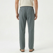 Men's linen drawstring trousers by FJØRNA, light and breathable fabric with relaxed fit and adjustable waistband.