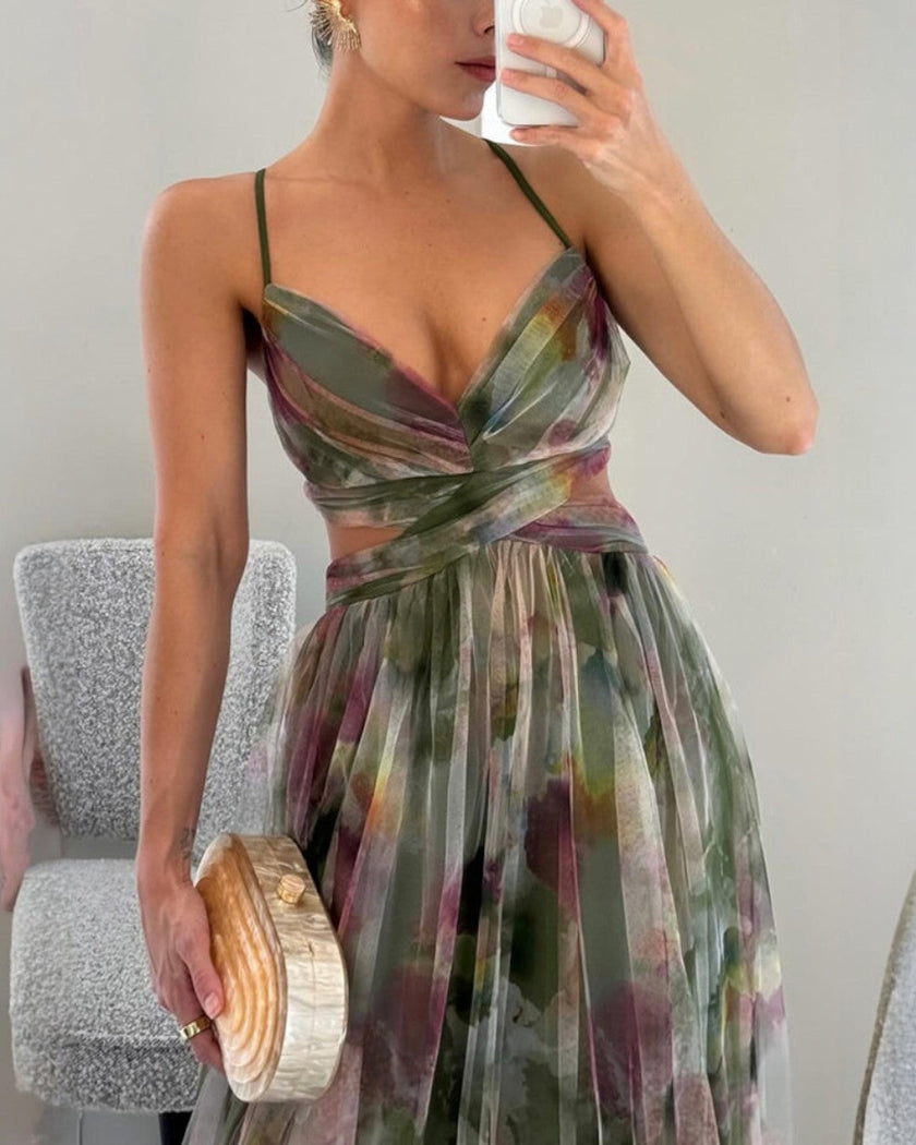 FJØRNA elegant floral maxi dress for women with V-neck, flowing fabric, and stylish design perfect for summer occasions.