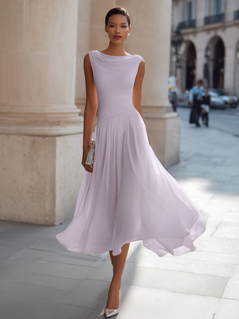 FJØRNA sleeveless pleated midi dress with draped neckline, flowing fabric, and elegant design perfect for stylish occasions.
