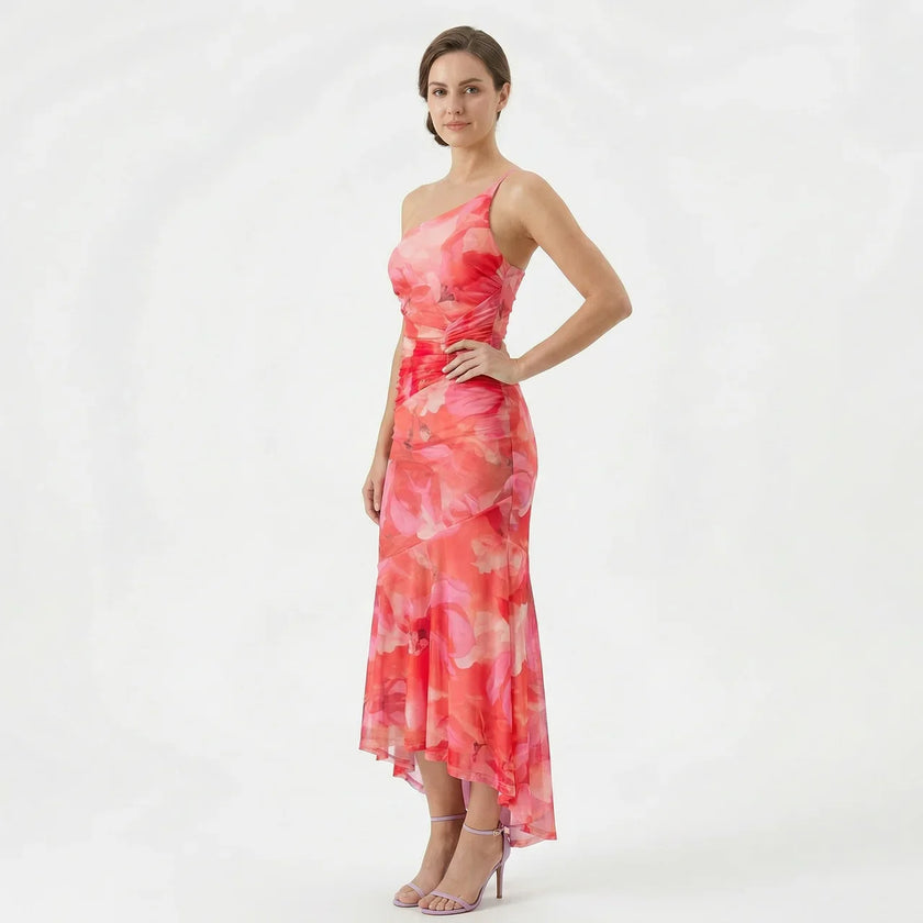 FJØRNA women's floral A-line maxi dress with a flowy silhouette and vibrant flower print, perfect for summer or special occasions.