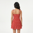 FJØRNA women's floral print mini dress with tie straps, featuring a vibrant pattern and sleeveless design for a stylish summer look.