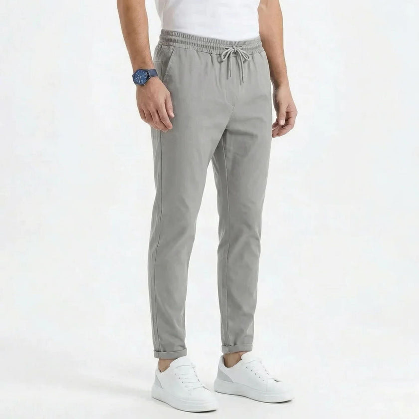 FJØRNA men's stretchable comfort trousers, casual men's pants with flexible fabric and classic fit, shown in dark blue.