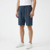 Men's summer linen shorts by FJØRNA, light and breathable fabric, displayed in a casual fit on a model.