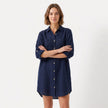 Women's oversized linen shirt dress by FJØRNA, featuring a relaxed fit, button-down front, and casual style, shown on a model.