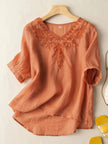 FJØRNA women's summer blouse with V-neck, linen fabric, flowy casual top, featuring short sleeves and lightweight design.