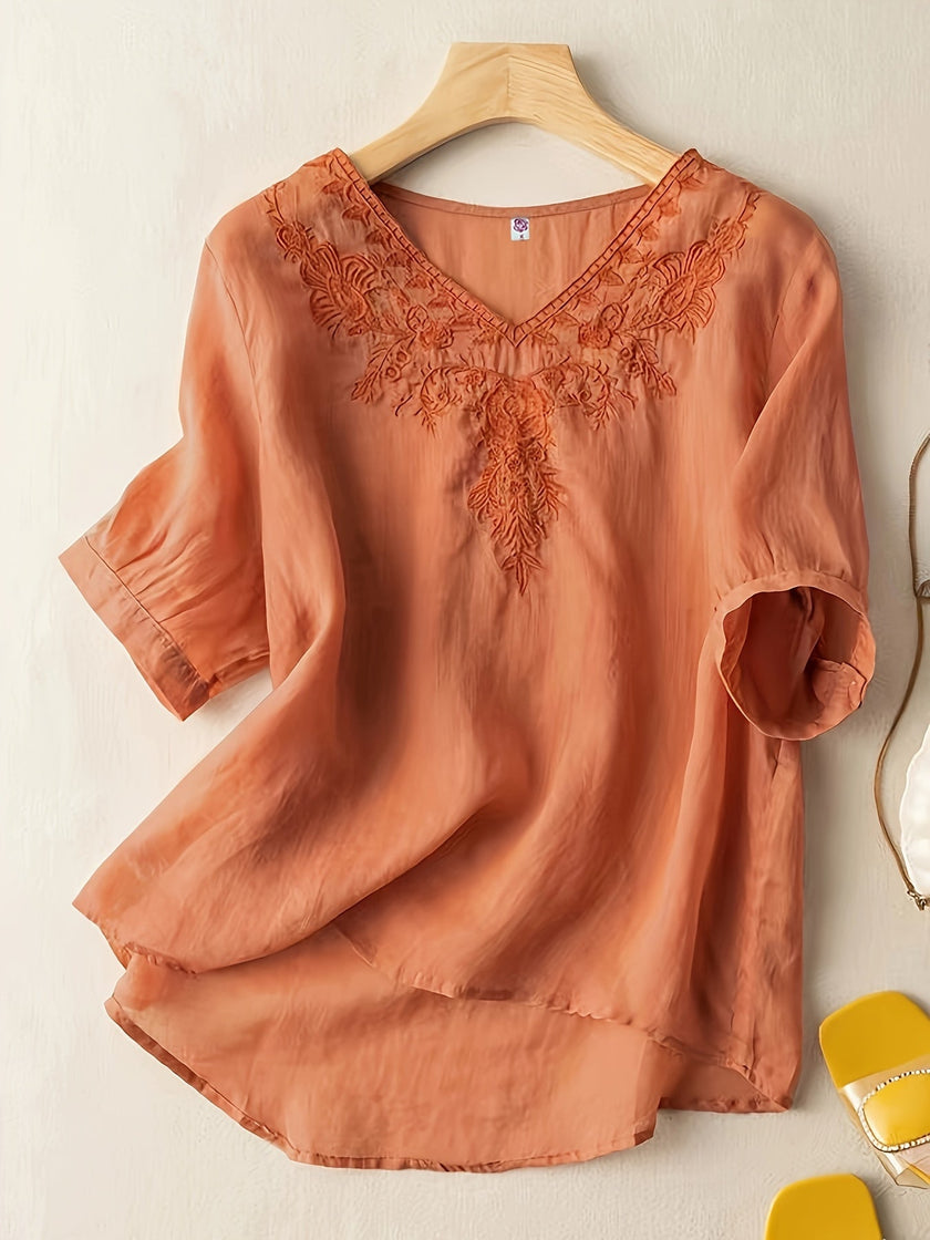 FJØRNA women's summer blouse with V-neck, linen fabric, flowy casual top, featuring short sleeves and lightweight design.