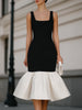 FJØRNA square neck sleeveless midi dress with ruffle hem, showcasing a stylish and elegant summer dress design.