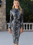 FJØRNA snake print long sleeve fitted midi dress with belt, showcasing a stylish leopard pattern and sleek silhouette.