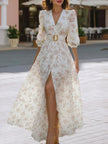 FJØRNA romantic floral chiffon maxi dress with belted waist, flowing fabric, and vibrant floral pattern for elegant summer wear.