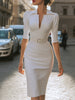 FJØRNA elegant belted V-neck tailored midi dress hanging on a rack, showcasing its sleek design and sophisticated style.