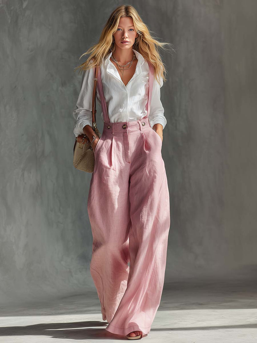 Pink cotton linen wide-leg dungarees for women by FJØRNA, featuring relaxed fit overalls with adjustable straps and side pockets.