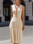 FJØRNA sleeveless V-neckline pleated midi dress displayed on a mannequin, showcasing elegant fabric and stylish design.