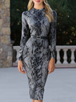 FJØRNA snake print long sleeve fitted midi dress with belt, showcasing a stylish and form-fitting design.