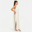 FJØRNA women's sleeveless halter neck summer maxi dress in lightweight fabric, flowing design, and vibrant color.