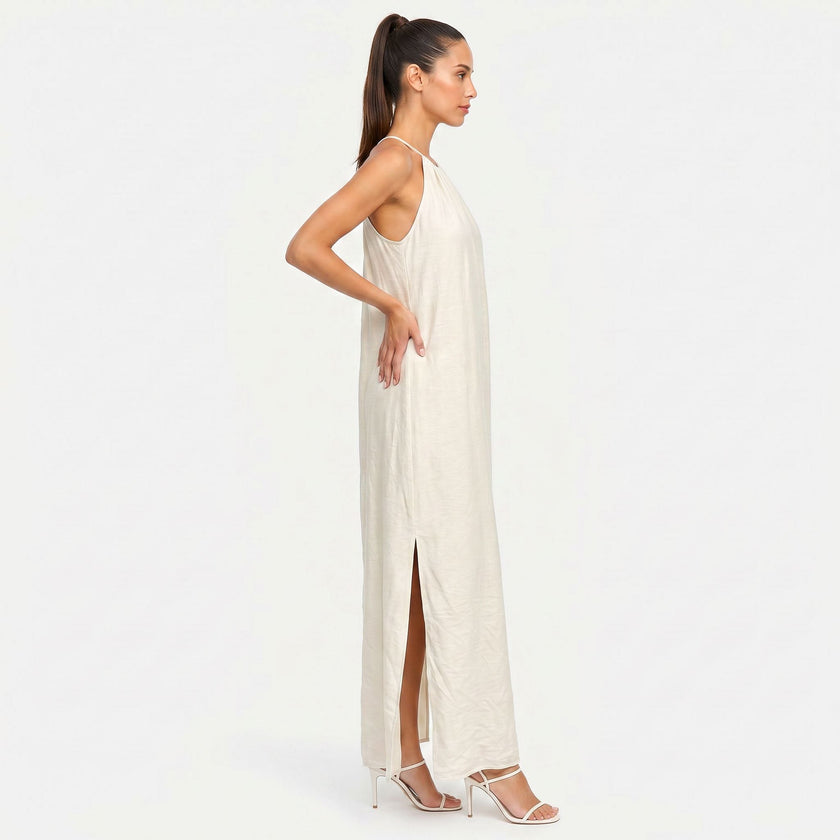 FJØRNA women's sleeveless halter neck summer maxi dress in lightweight fabric, flowing design, and vibrant color.