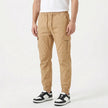 Men's slim fit cotton cargo trousers by FJØRNA, featuring multiple pockets and a sleek, modern design in neutral fabric.