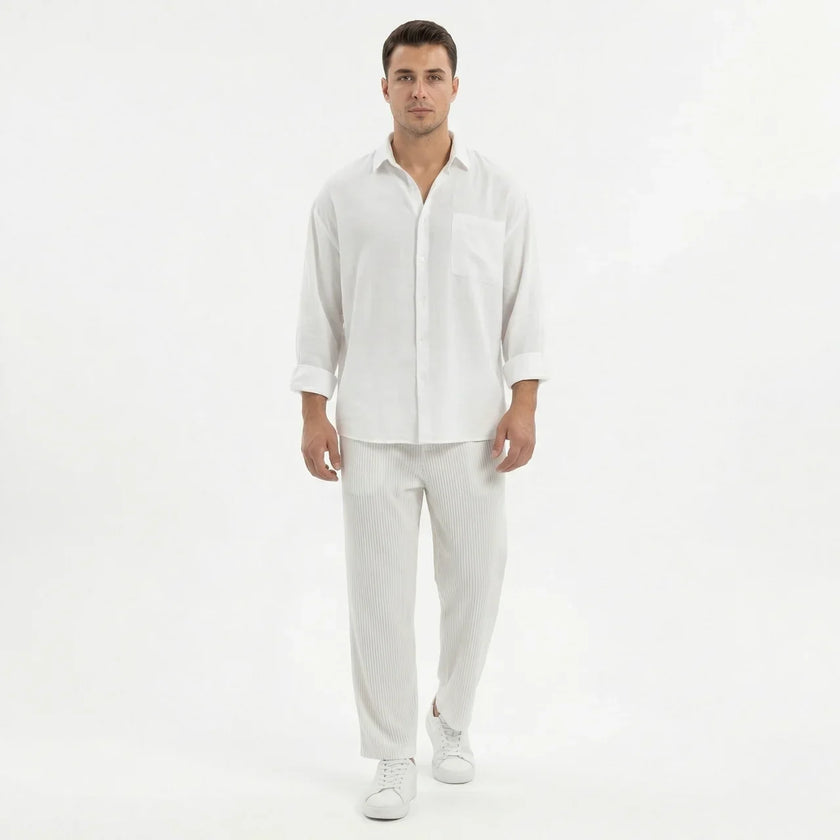 Men's wide-leg summer pants by FJØRNA, shown in light fabric with relaxed fit, perfect for warm weather casual wear.
