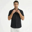Men's cotton-linen short sleeve shirt by FJØRNA, lightweight and breathable with a casual button-up style, shown in the image.
