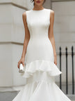 FJØRNA sleeveless tiered ruffle midi dress with layered fabric and flowing silhouette, perfect for summer or special occasions.