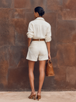 FJØRNA women's cotton-linen shirt jumpsuit with lapel collar, long sleeves, and button-down front, styled as versatile pants.