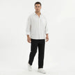 Men's wide leg summer pants from FJØRNA, featuring lightweight fabric and relaxed fit, displayed on a hanger.