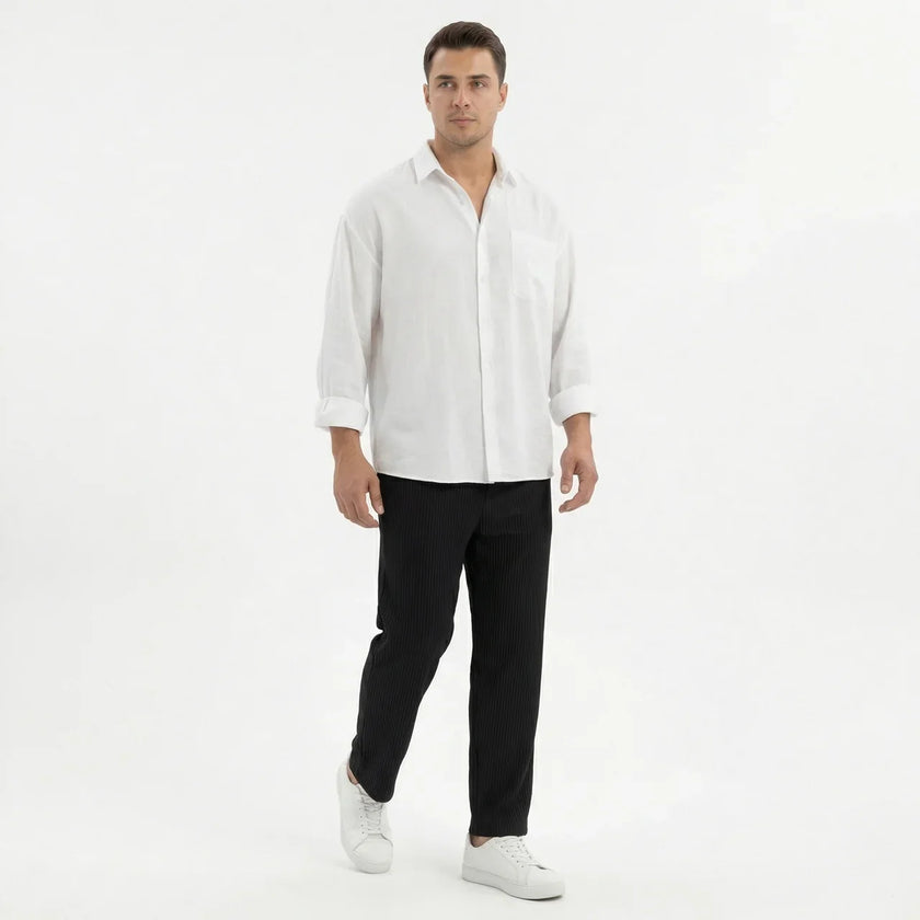 Men's wide leg summer pants from FJØRNA, featuring lightweight fabric and relaxed fit, displayed on a hanger.