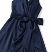 Women's elegant sleeveless wrap midi dress by FJØRNA, featuring a stylish design and flowing fabric, perfect for formal occasions