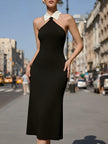 FJØRNA black halter midi dress with contrast white Peter Pan collar, elegant and stylish for formal or casual occasions.