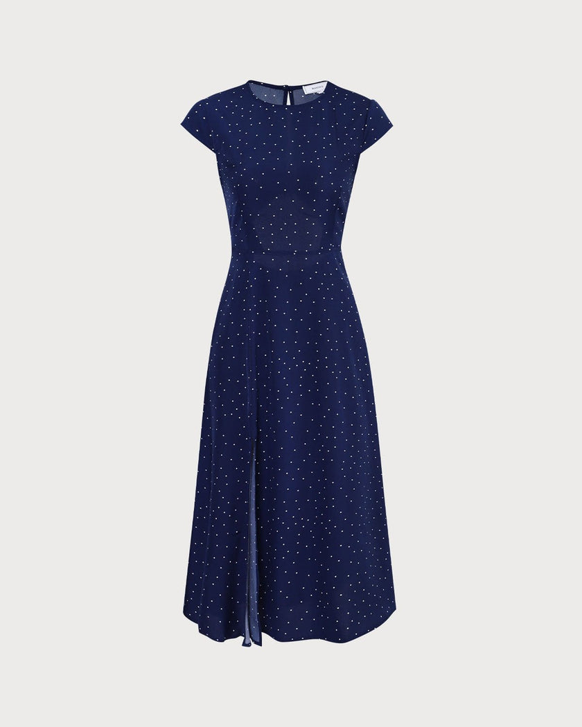 FJØRNA polka dot midi dress for women with round neck and cutout details, featuring a stylish and elegant design.
