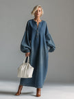 FJØRNA blue denim maxi dress with long sleeves and flowing silhouette, perfect for casual or evening wear.