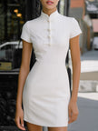 FJØRNA Mandarin Collar Modern Knot-Button Mini Dress displayed on a hanger, showcasing its stylish collar and button details.