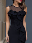 FJØRNA sheer neckline ruffle-trim sculpted midi dress displayed on a model, showcasing elegant design and fitted silhouette.