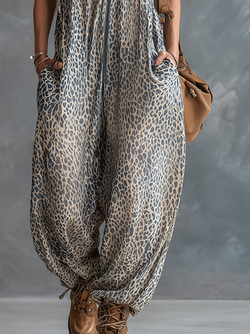 FJØRNA apricot leopard print hooded chiffon jumpsuit with long sleeves and relaxed fit, showcasing its stylish pattern and lightweight fabric.