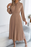 FJØRNA solid color long-sleeved fitted waist pleated elegant midi dress displayed on a model.