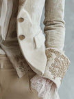 Ivory embroidered velvet blazer with long sleeves and lace cuff details by FJØRNA, stylish and elegant for formal wear.
