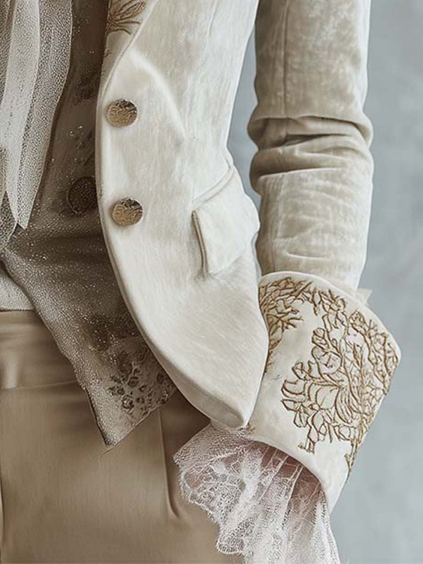 Ivory embroidered velvet blazer with long sleeves and lace cuff details by FJØRNA, stylish and elegant for formal wear.