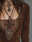 Vintage brown suede mini dress with embroidered detailing by FJØRNA, featuring a fitted silhouette and bohemian style.