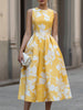 FJØRNA sleeveless floral print midi dress with a fitted waist and flowing skirt, ideal for summer or casual occasions.