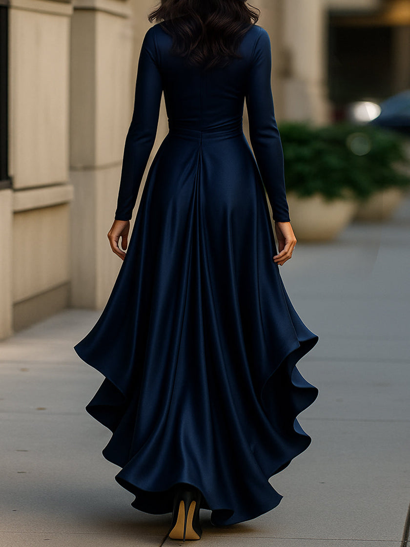FJØRNA midnight blue satin maxi dress with draped fabric and ruffle details, perfect for elegant evening occasions.