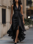 FJØRNA Midnight Elegance satin halter ruffle gown displayed on a dress form, featuring a flowing black satin fabric with ruffle details