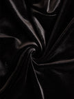 Elegant black velvet and satin midi dress for women by FJØRNA, featuring a sophisticated design and flowing silhouette.