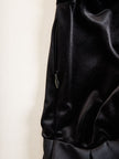 Elegant black velvet and satin midi dress by FJØRNA, featuring a stylish, fitted design perfect for formal occasions.