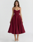 FJØRNA women's corset midi dress with tulle skirt, featuring a topaz-colored bodice and elegant design for special occasions.