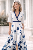 Elegant floral V-neck dress for women by FJØRNA, featuring a stylish and comfortable design perfect for special occasions.